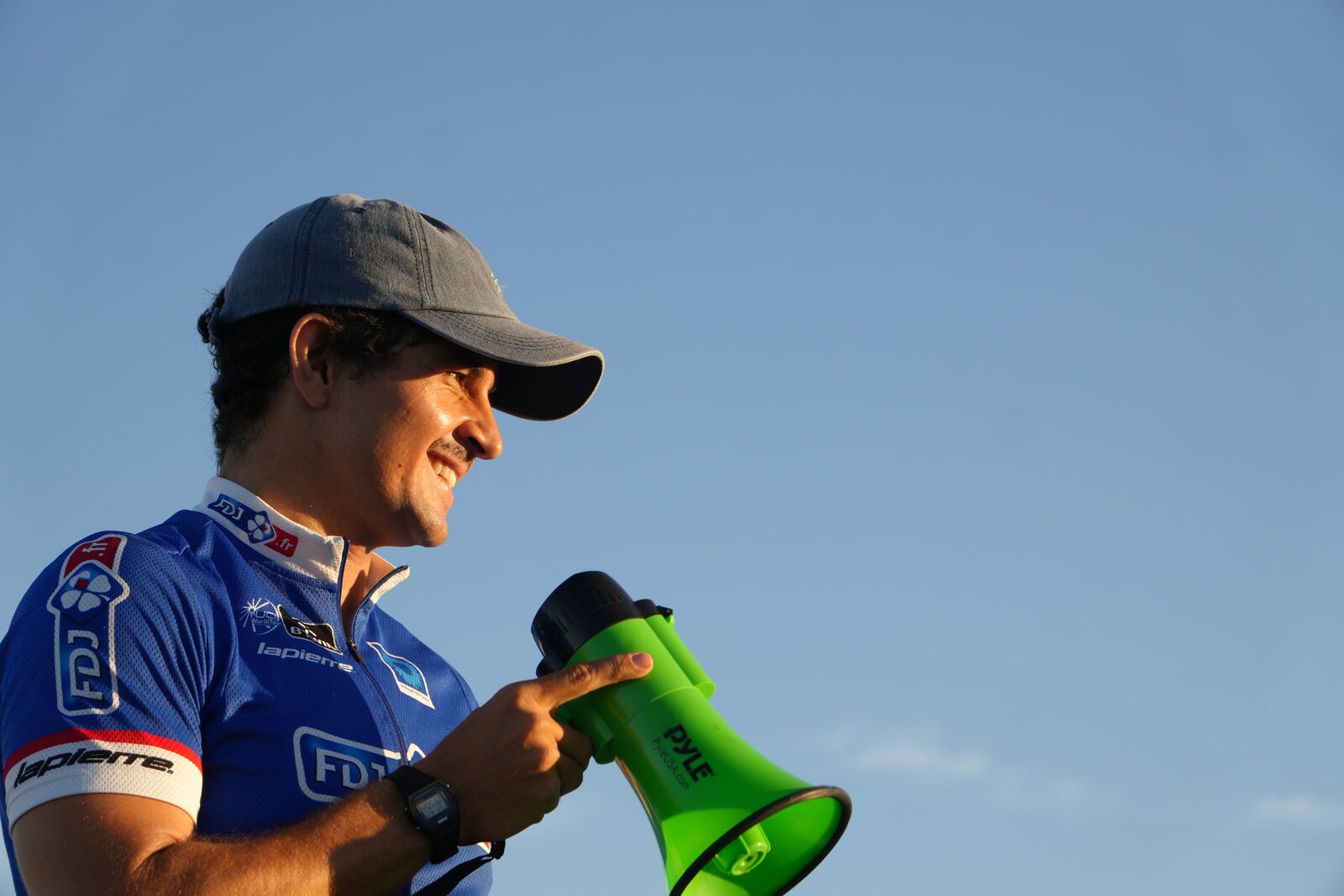 Host calling out the next game through a megaphone