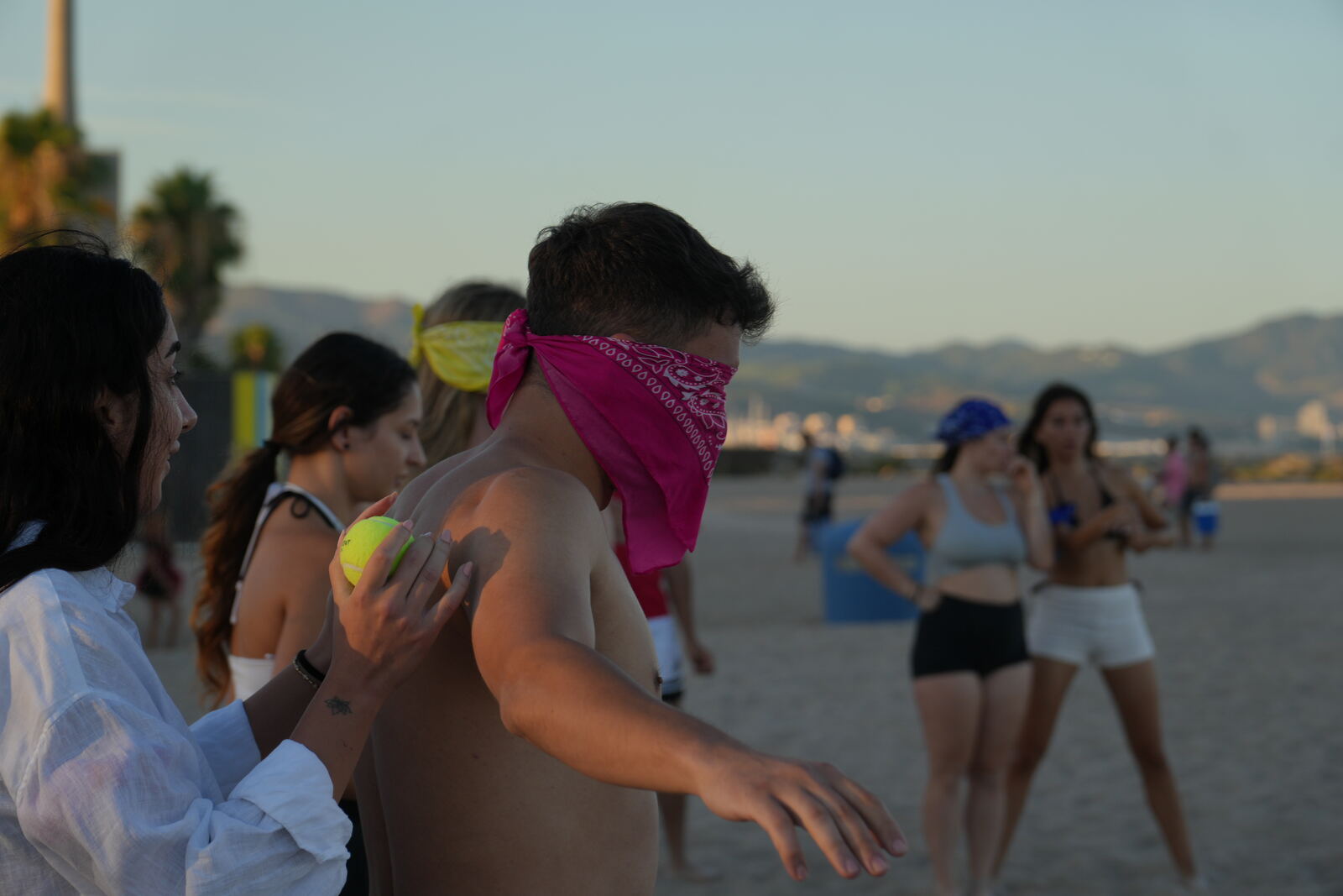 A blindfolded player being guided by teammates during a game